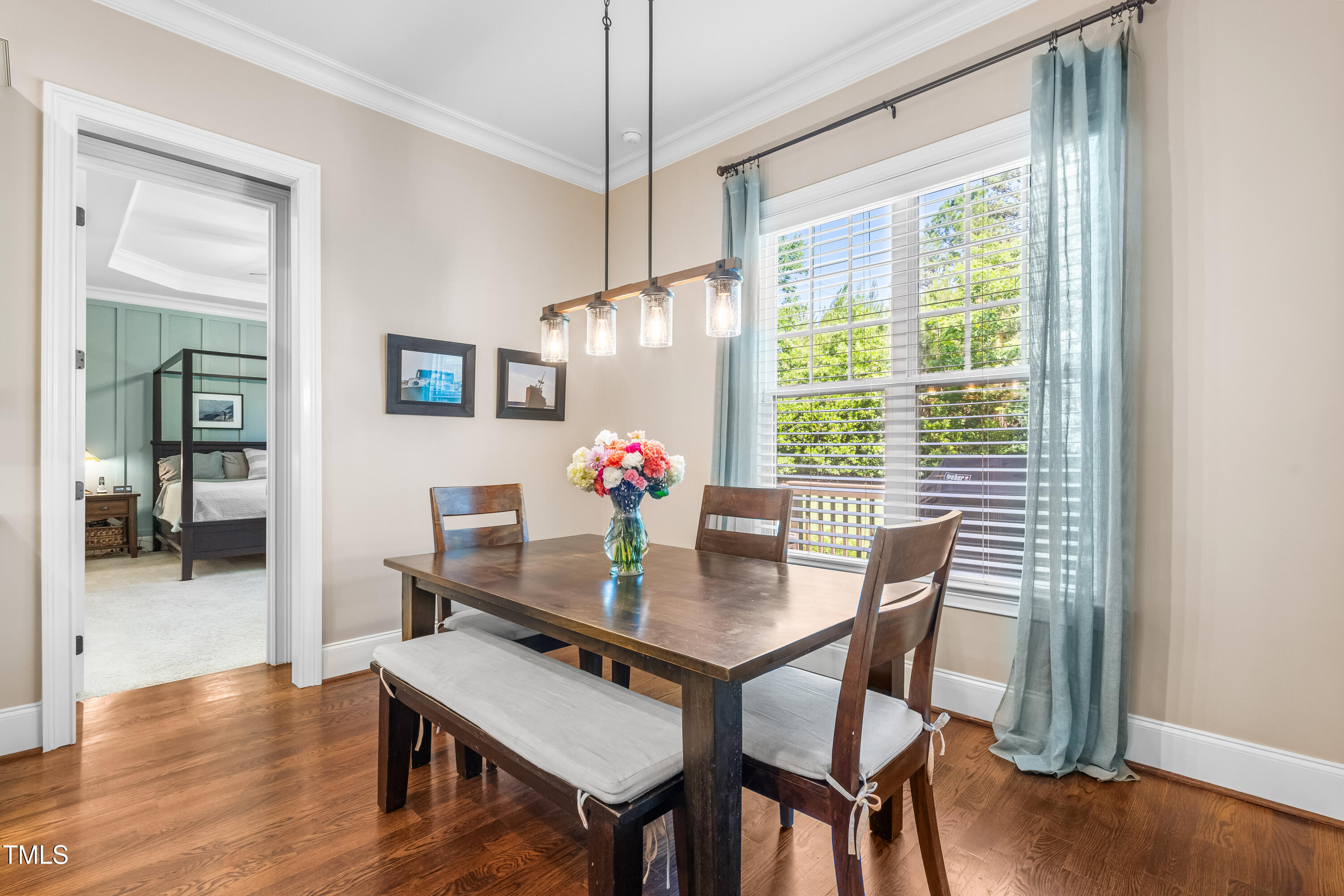 2538 Tuffeto Apex, NC 27502 - Photo 20 of 55 a view of a dining room with furniture window and wooden floor