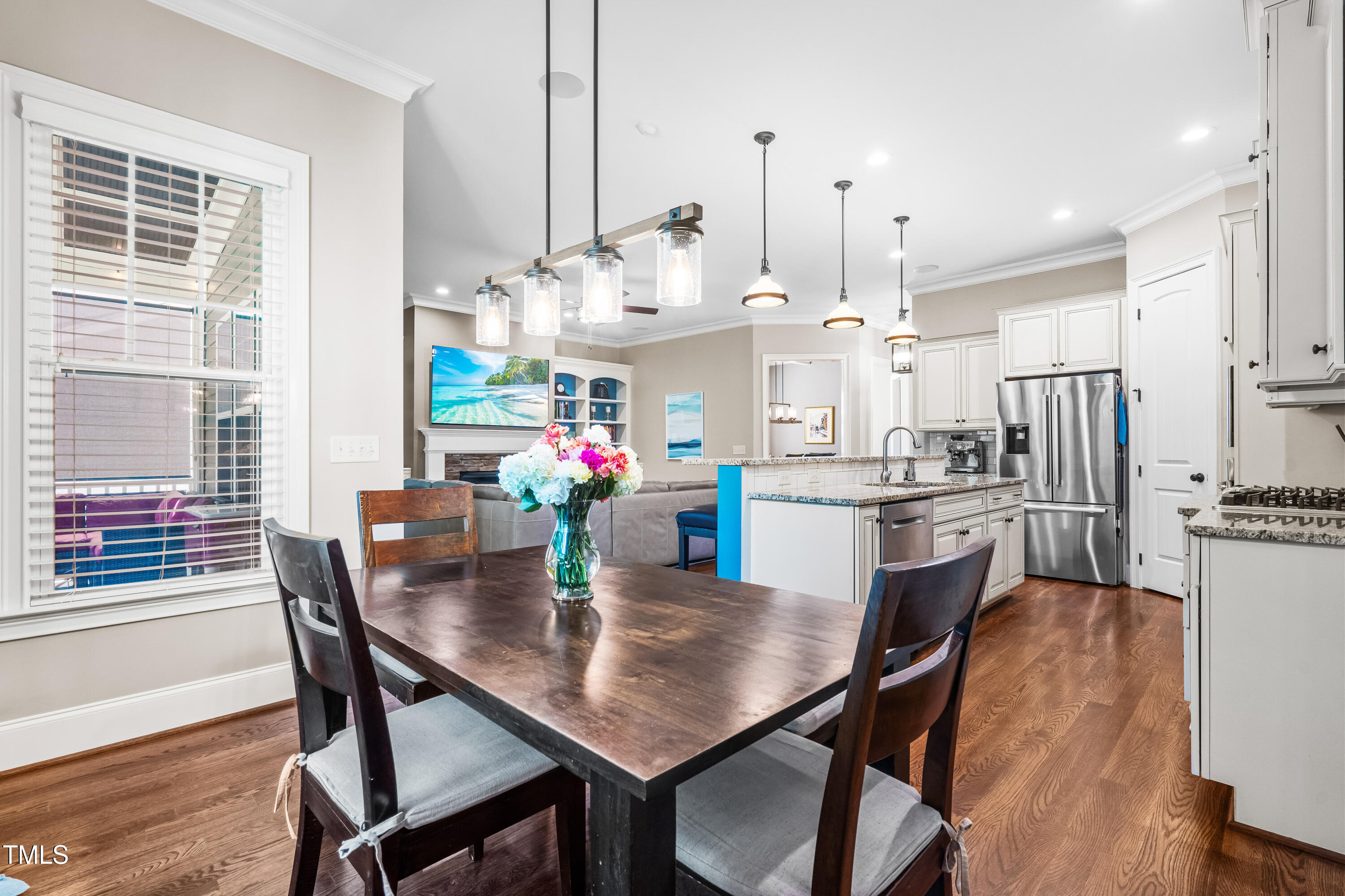 2538 Tuffeto Apex, NC 27502 - Photo 21 of 55 a view of a dining room and livingroom with furniture wooden floor kitchen chandelier