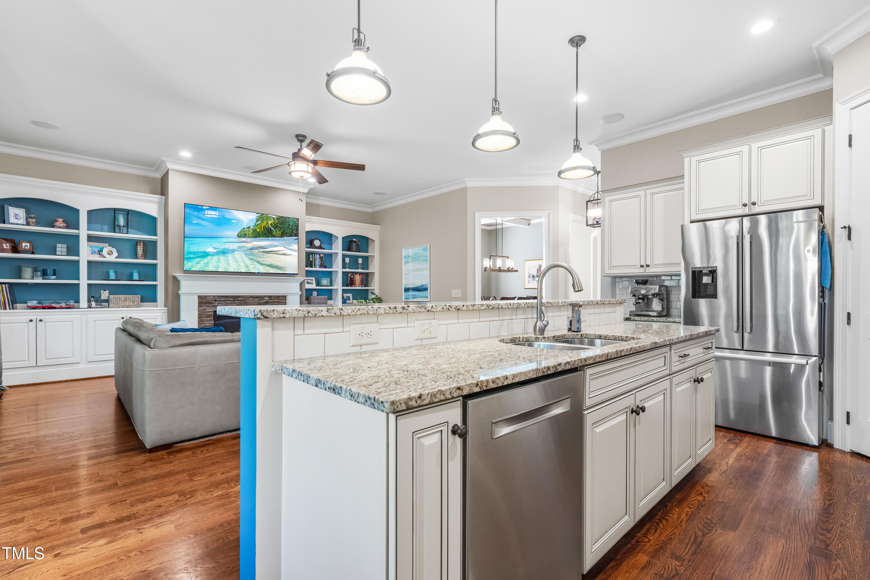 2538 Tuffeto Apex, NC 27502 - Photo 22 of 55 a kitchen with stainless steel appliances granite countertop a sink a stove and a wooden floors