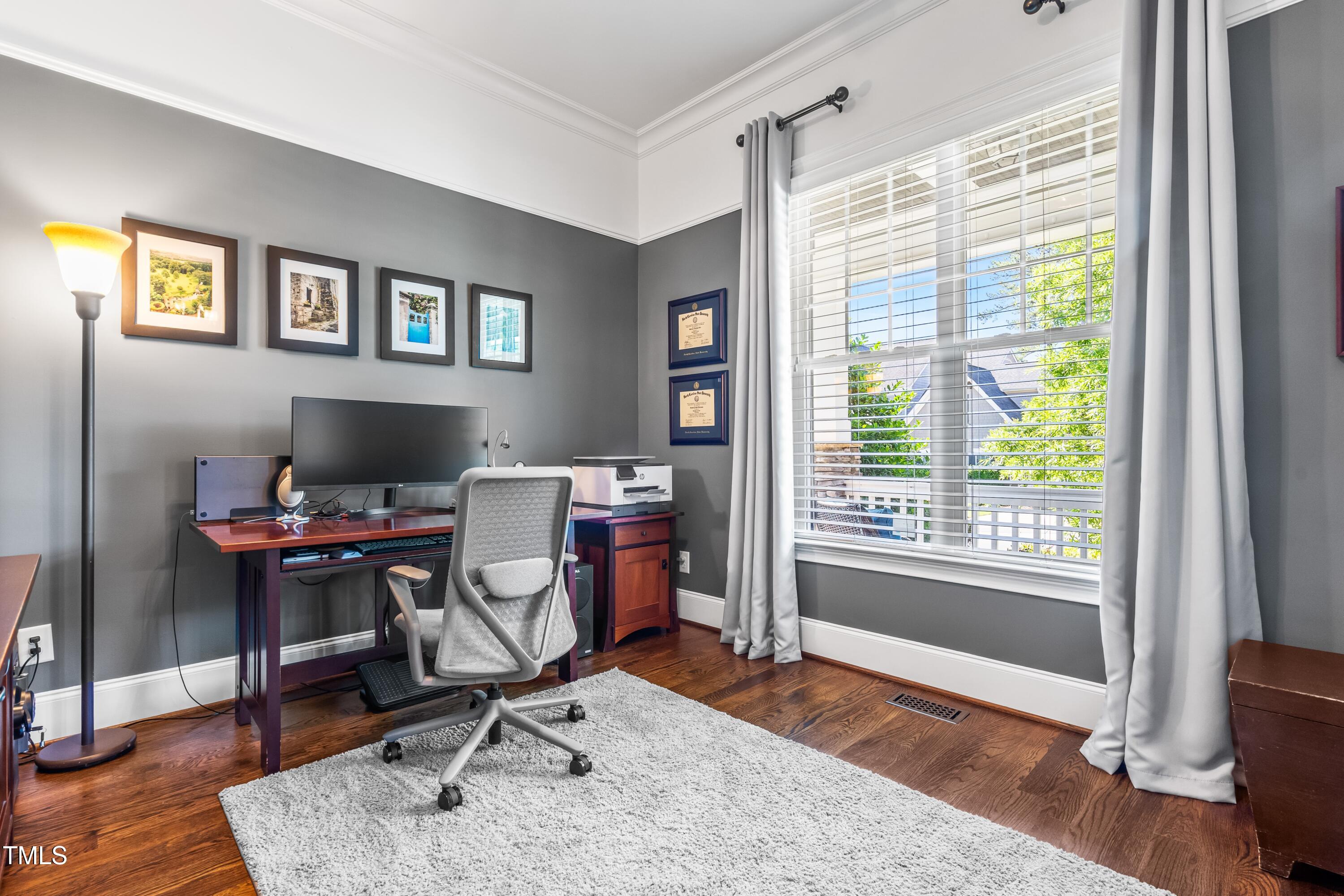 2538 Tuffeto Apex, NC 27502 - Photo 25 of 55 a view of a workspace with furniture and a window