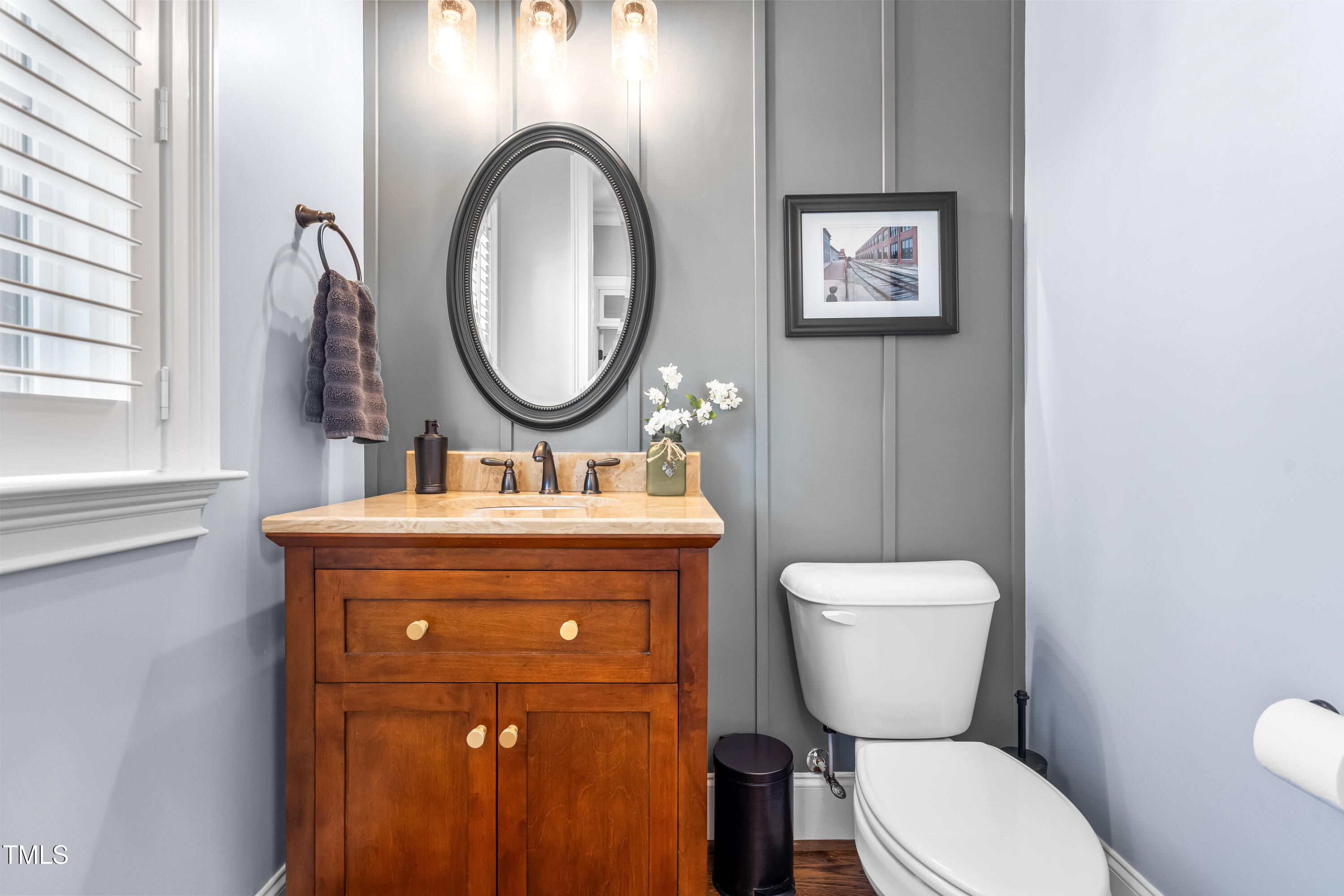 2538 Tuffeto Apex, NC 27502 - Photo 27 of 55 a bathroom with a toilet a sink and a mirror