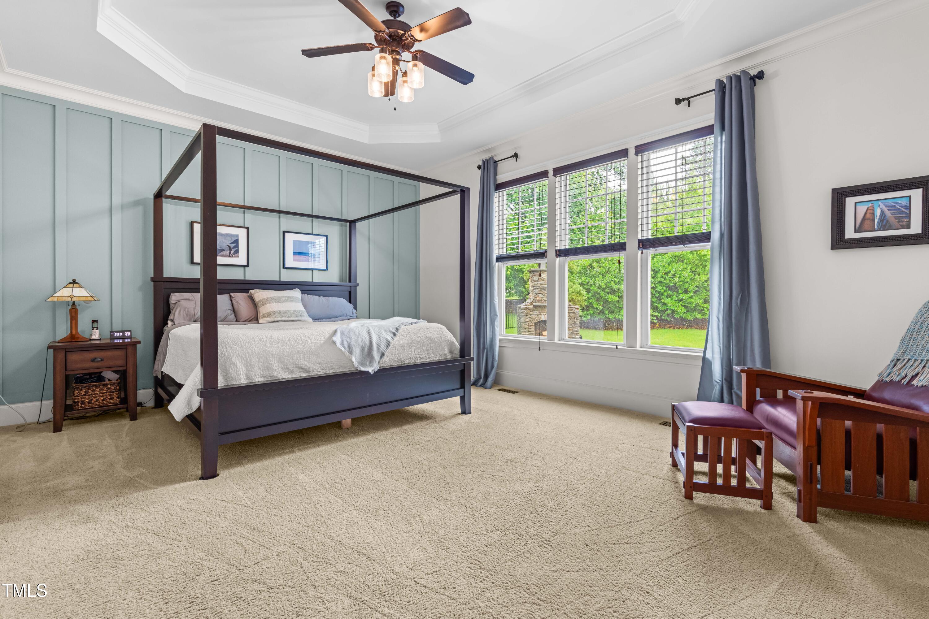 2538 Tuffeto Apex, NC 27502 - Photo 29 of 55 a bedroom with a bed and a chandelier