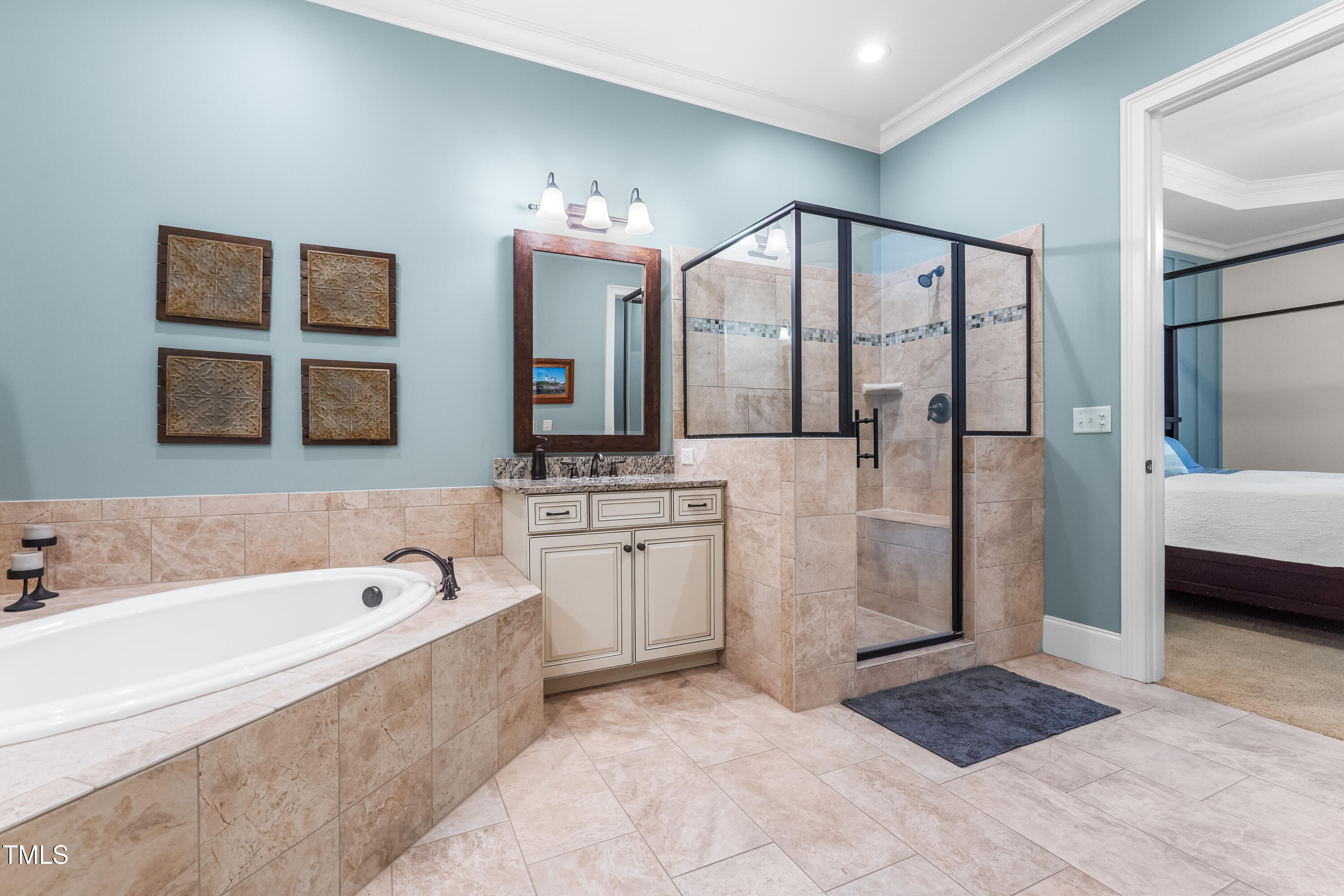 2538 Tuffeto Apex, NC 27502 - Photo 34 of 55 a spacious bathroom with a tub sink shower and mirror