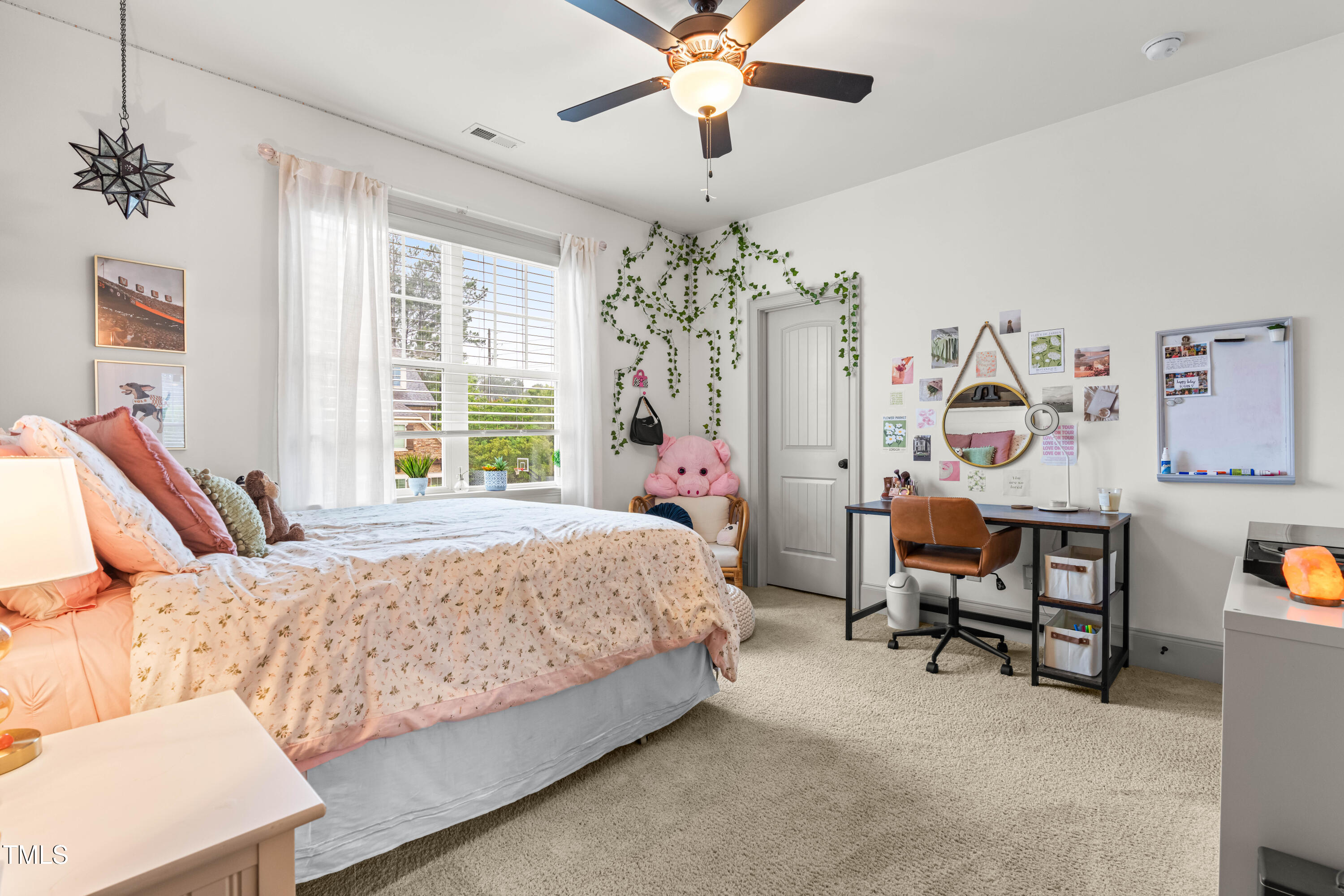 2538 Tuffeto Apex, NC 27502 - Photo 39 of 55 a bedroom with a bed furniture and a chandelier