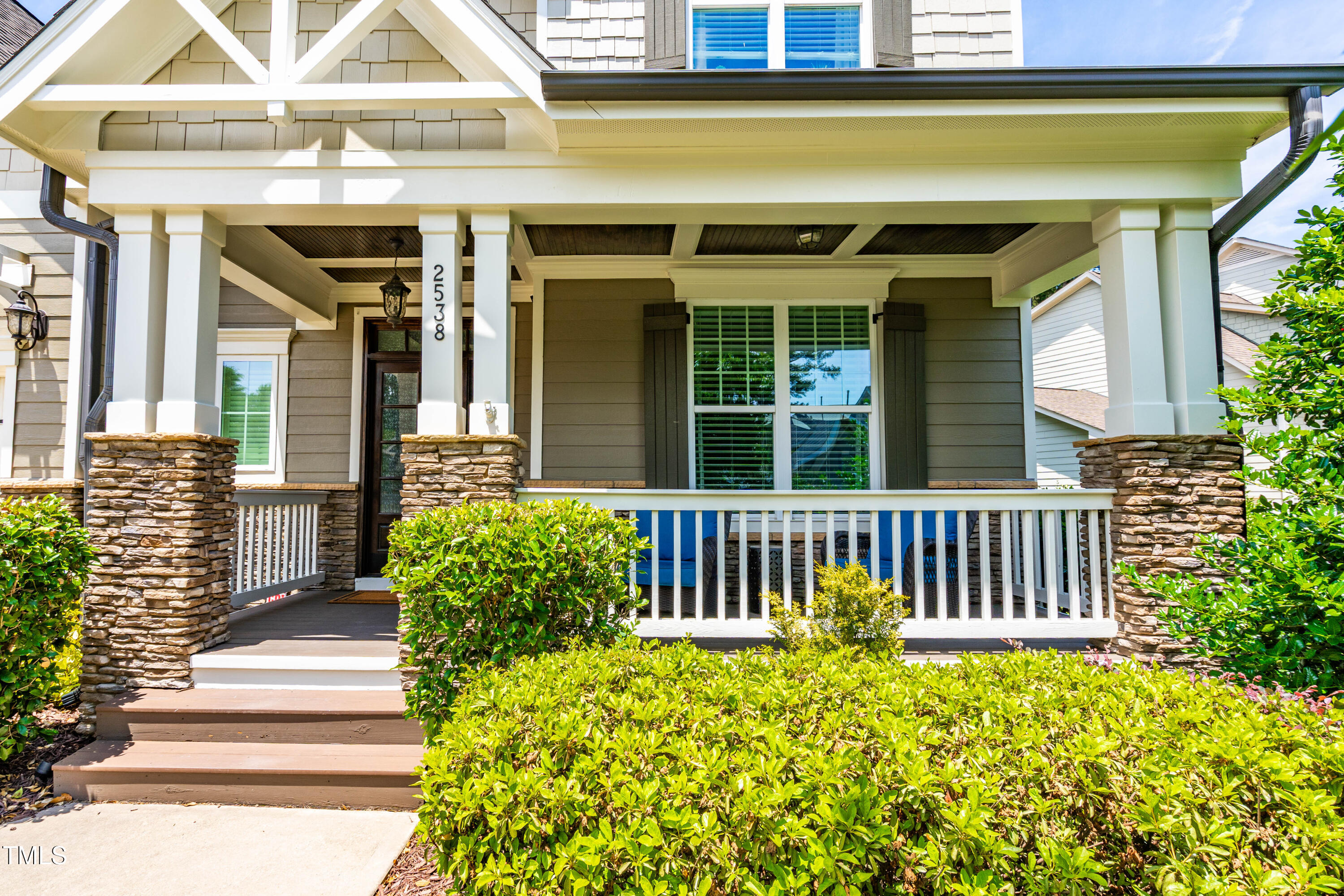 2538 Tuffeto Apex, NC 27502 - Photo 4 of 55 a view of a house with a small deck and a floor to ceiling window and wooden fence
