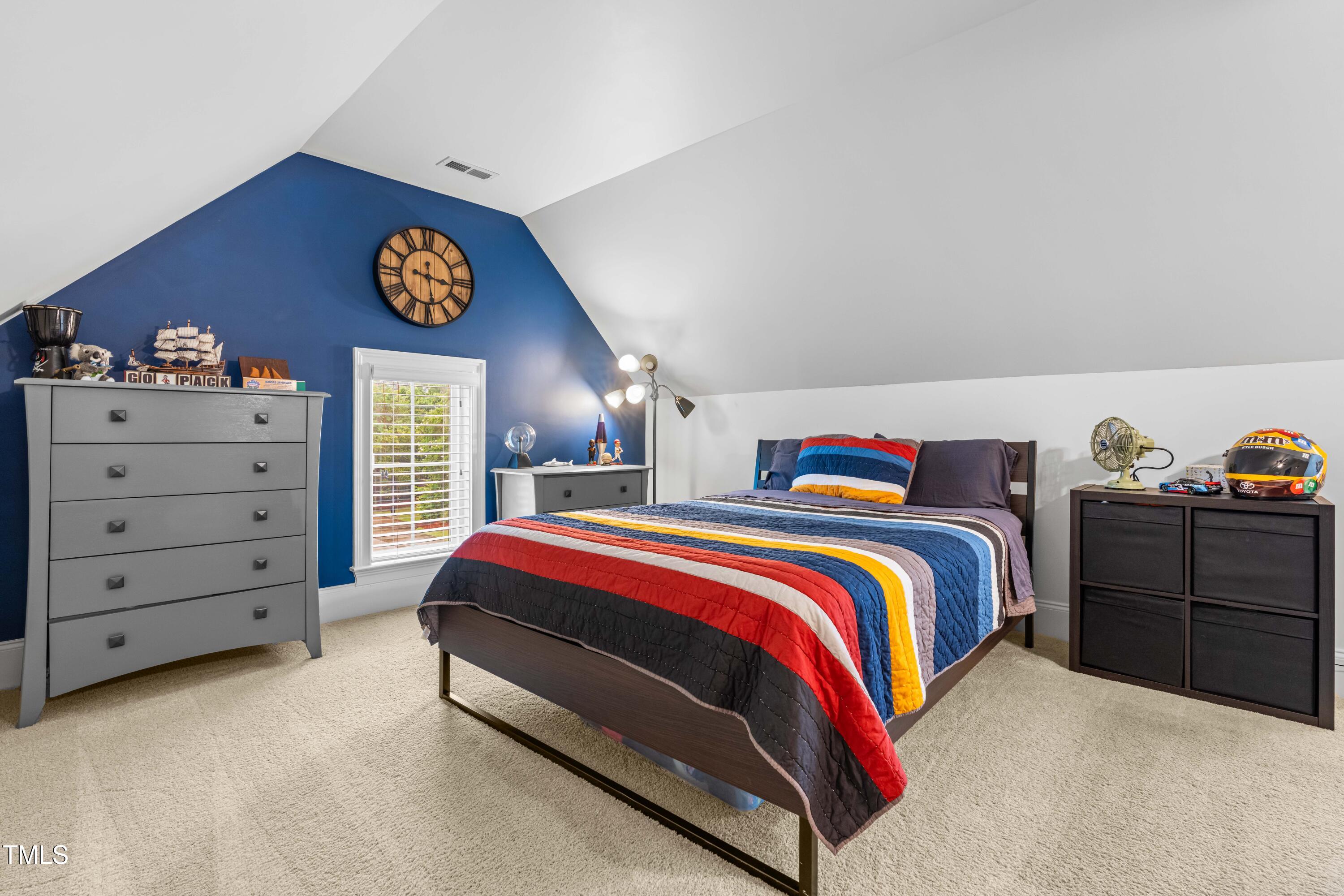 2538 Tuffeto Apex, NC 27502 - Photo 41 of 55 a bedroom with a bed and dresser