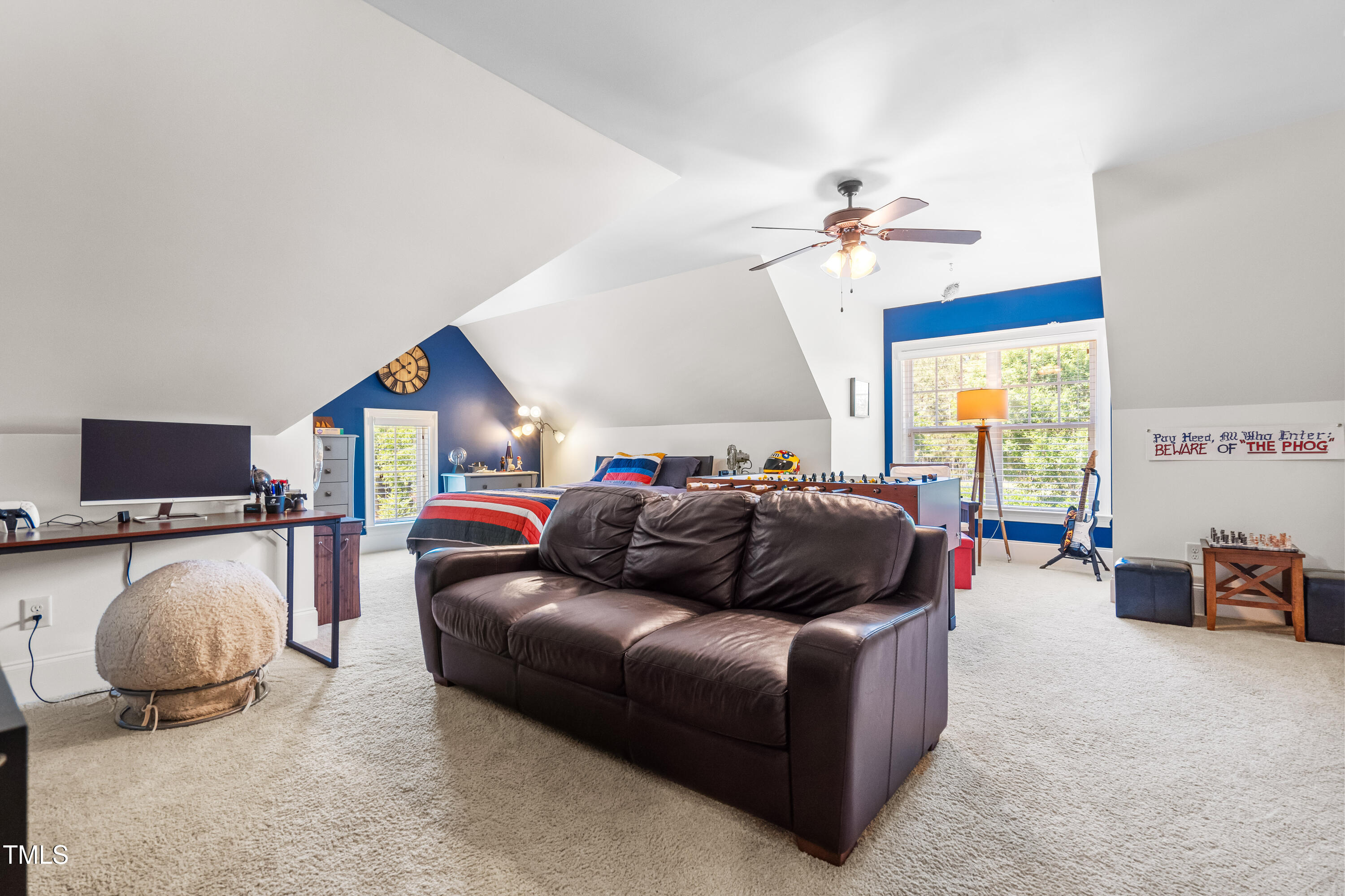 2538 Tuffeto Apex, NC 27502 - Photo 42 of 55 a living room with furniture a flat screen tv and a window