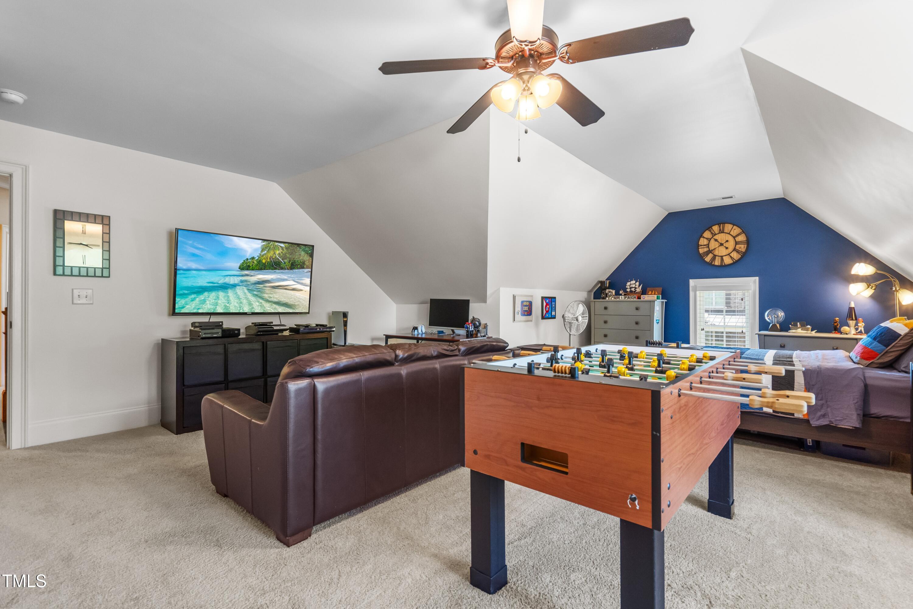 2538 Tuffeto Apex, NC 27502 - Photo 43 of 55 a living room with furniture and a flat screen tv