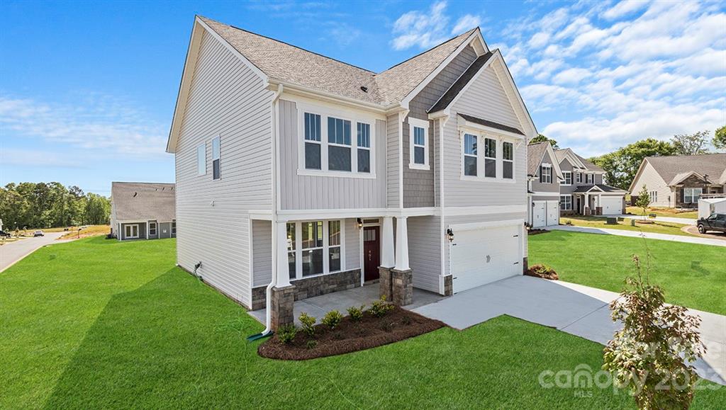 679 Fox Cove Road Hendersonville, NC 28792 - Photo 1 of 35 a view of a white house next to a yard and trees