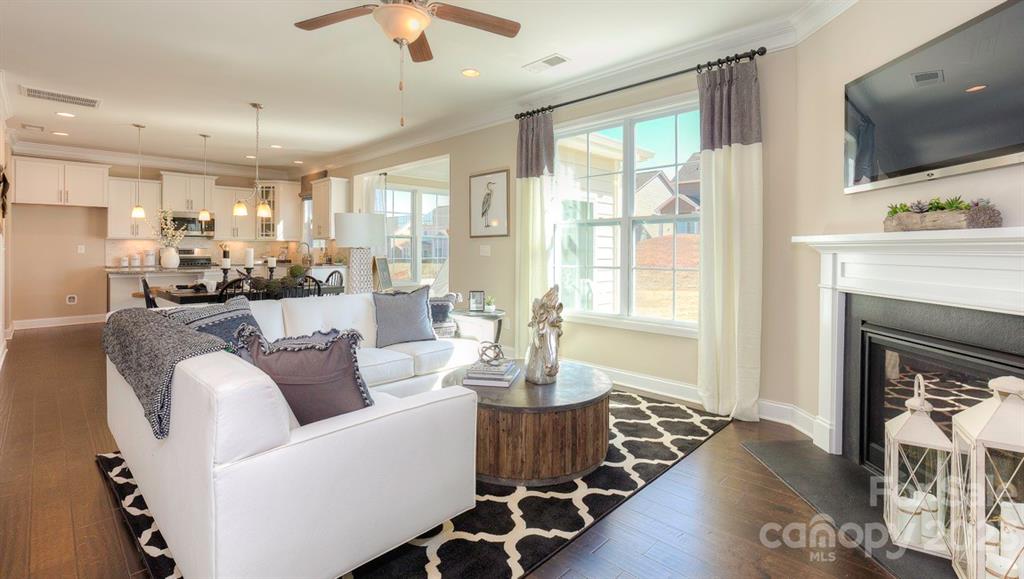 679 Fox Cove Road Hendersonville, NC 28792 - Photo 14 of 35 a living room with furniture large window and wooden floor
