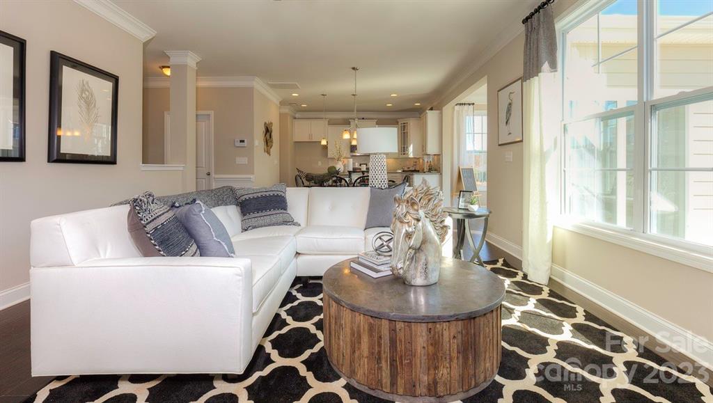 679 Fox Cove Road Hendersonville, NC 28792 - Photo 15 of 35 a dining room with furniture and wooden floor