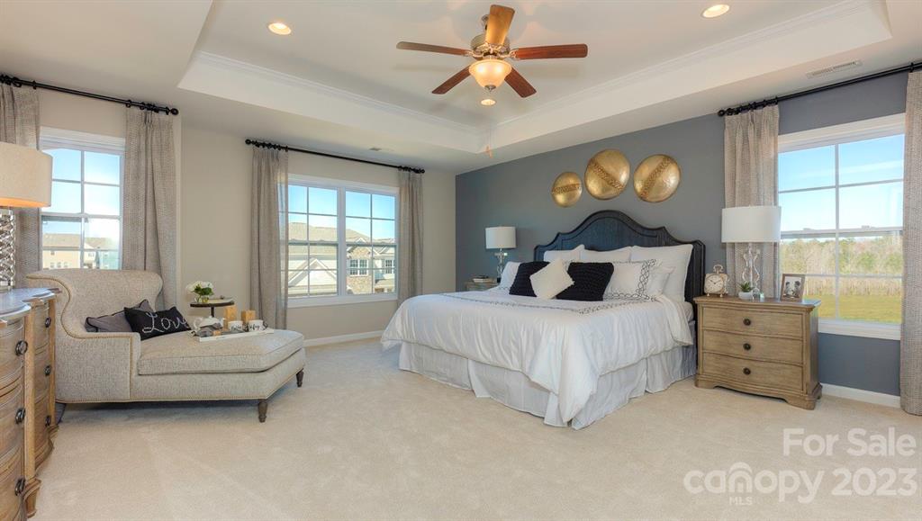 679 Fox Cove Road Hendersonville, NC 28792 - Photo 21 of 35 a spacious bedroom with a bed and a large window