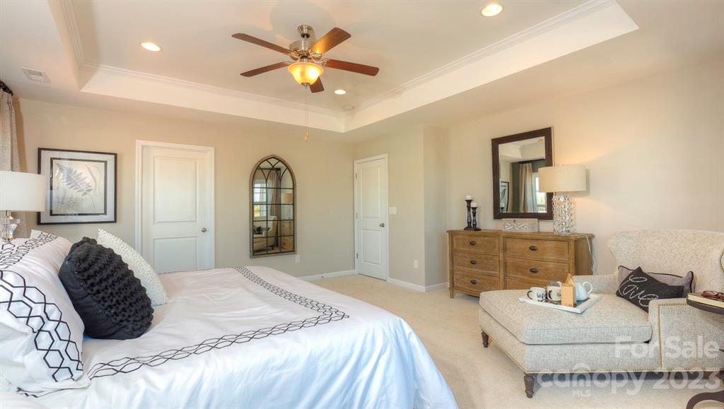 679 Fox Cove Road Hendersonville, NC 28792 - Photo 22 of 35 a bedroom with a bed and ceiling fan