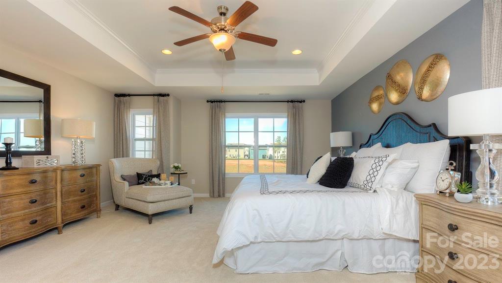 679 Fox Cove Road Hendersonville, NC 28792 - Photo 24 of 35 a bedroom with a bed and a chandelier