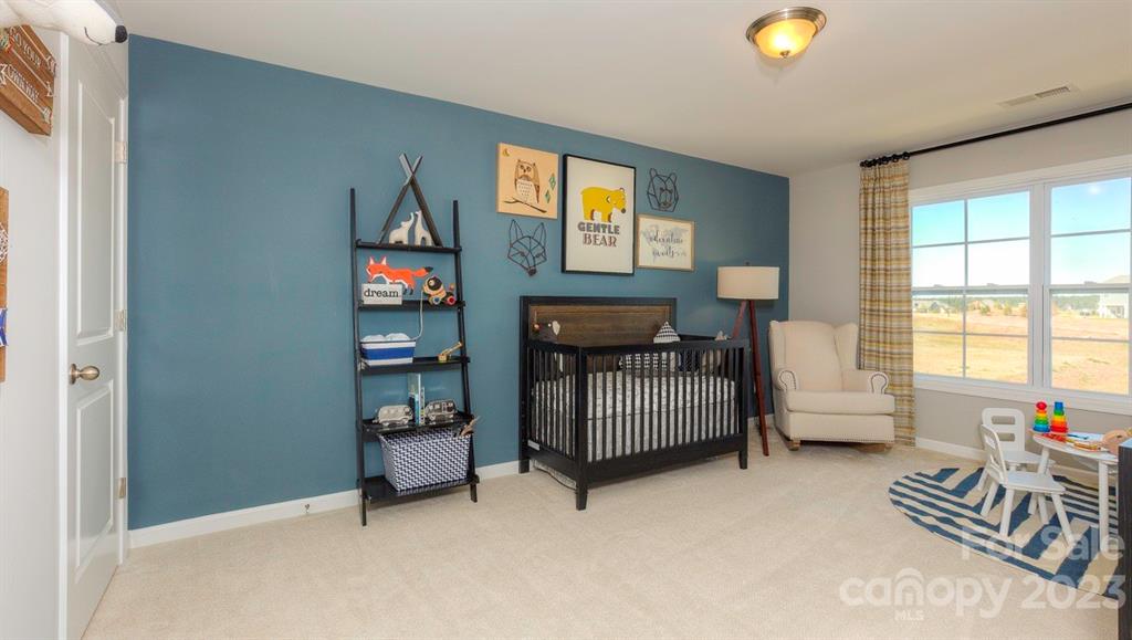 679 Fox Cove Road Hendersonville, NC 28792 - Photo 30 of 35 a bedroom with furniture and a window