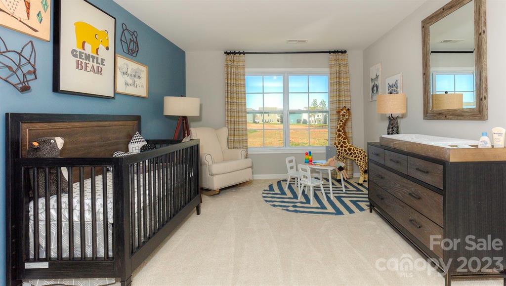 679 Fox Cove Road Hendersonville, NC 28792 - Photo 31 of 35 a bedroom with furniture and a window