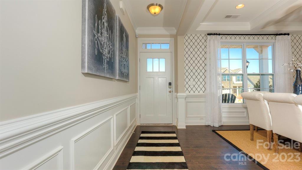 679 Fox Cove Road Hendersonville, NC 28792 - Photo 4 of 35 a view of a hallway with wooden floor and staircase