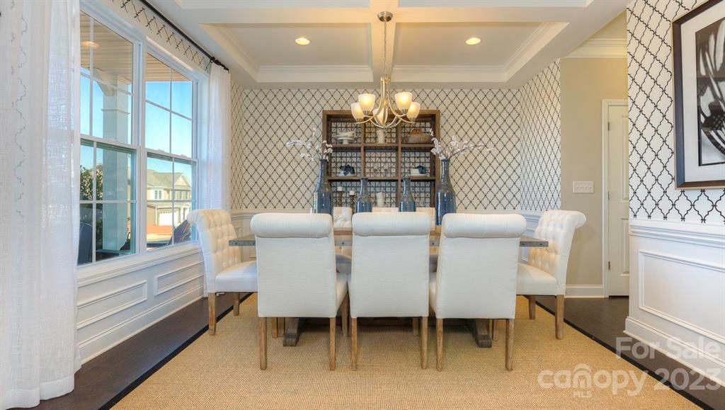 679 Fox Cove Road Hendersonville, NC 28792 - Photo 5 of 35 a dining room with furniture a chandelier and window
