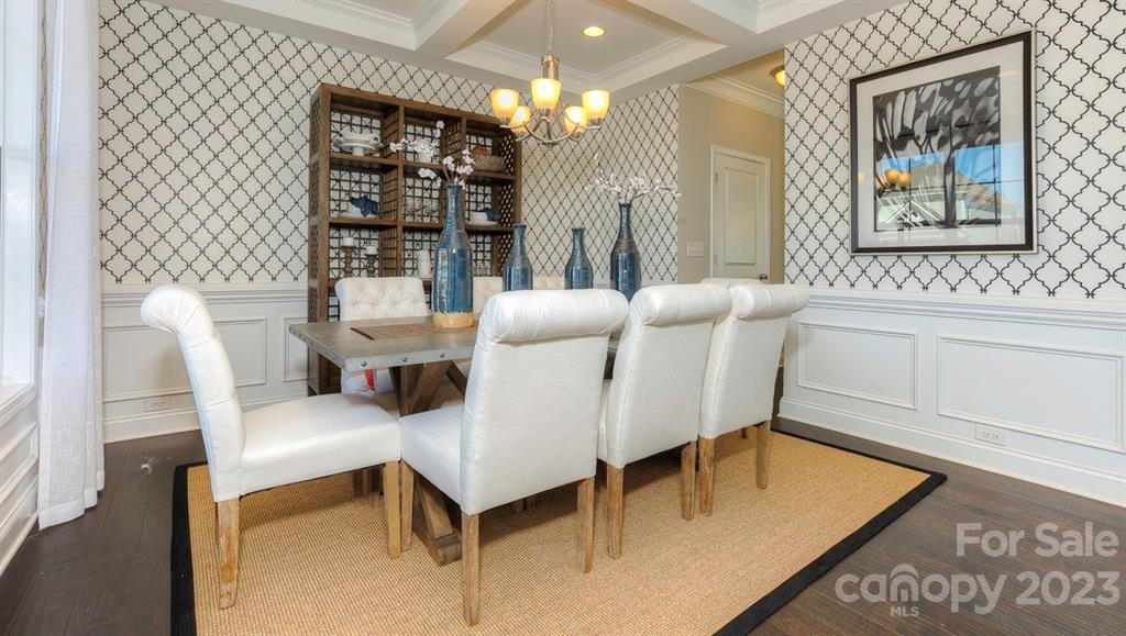 679 Fox Cove Road Hendersonville, NC 28792 - Photo 6 of 35 a living room with furniture a lamp and a large window