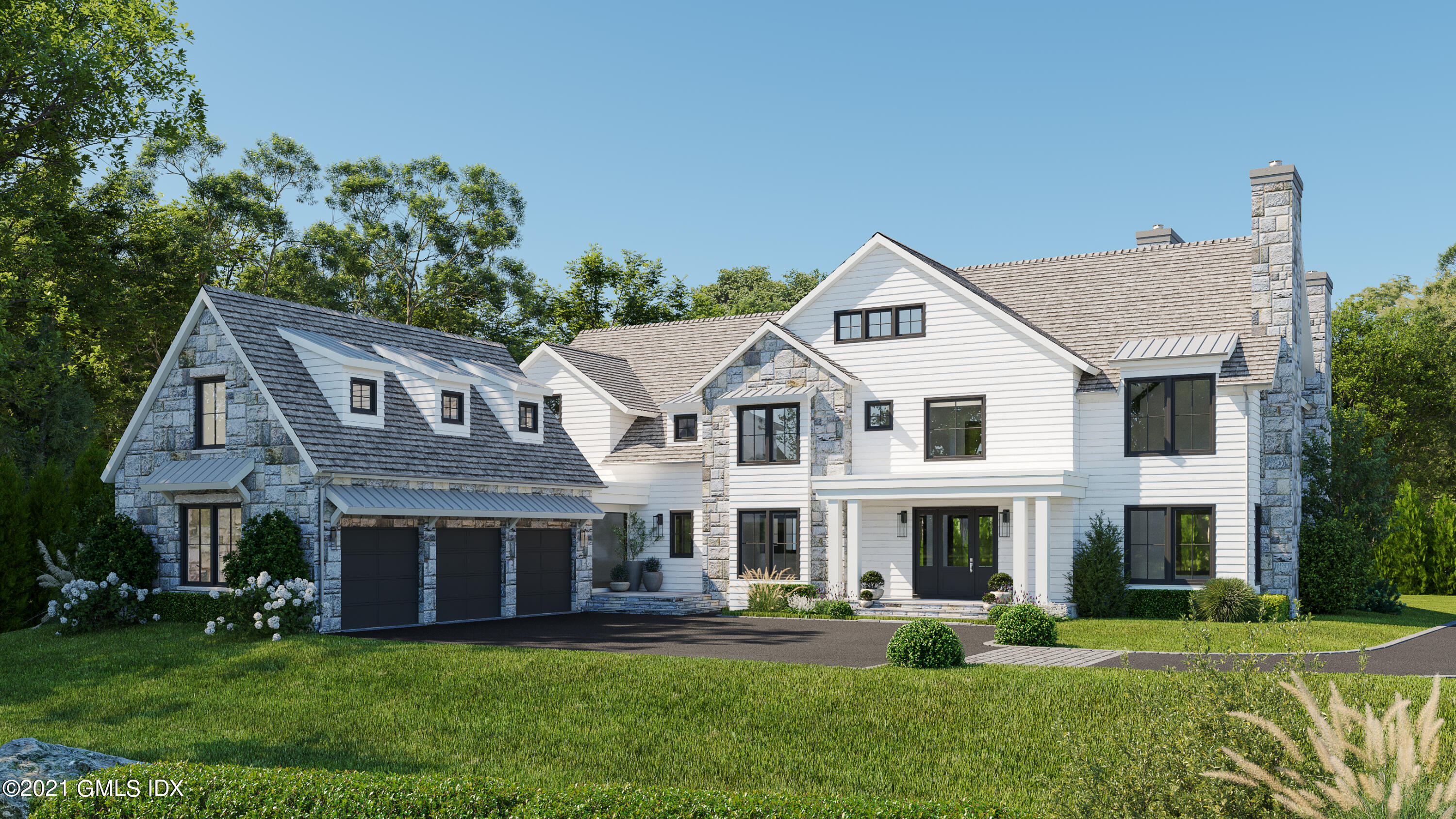 a front view of the house with a garden