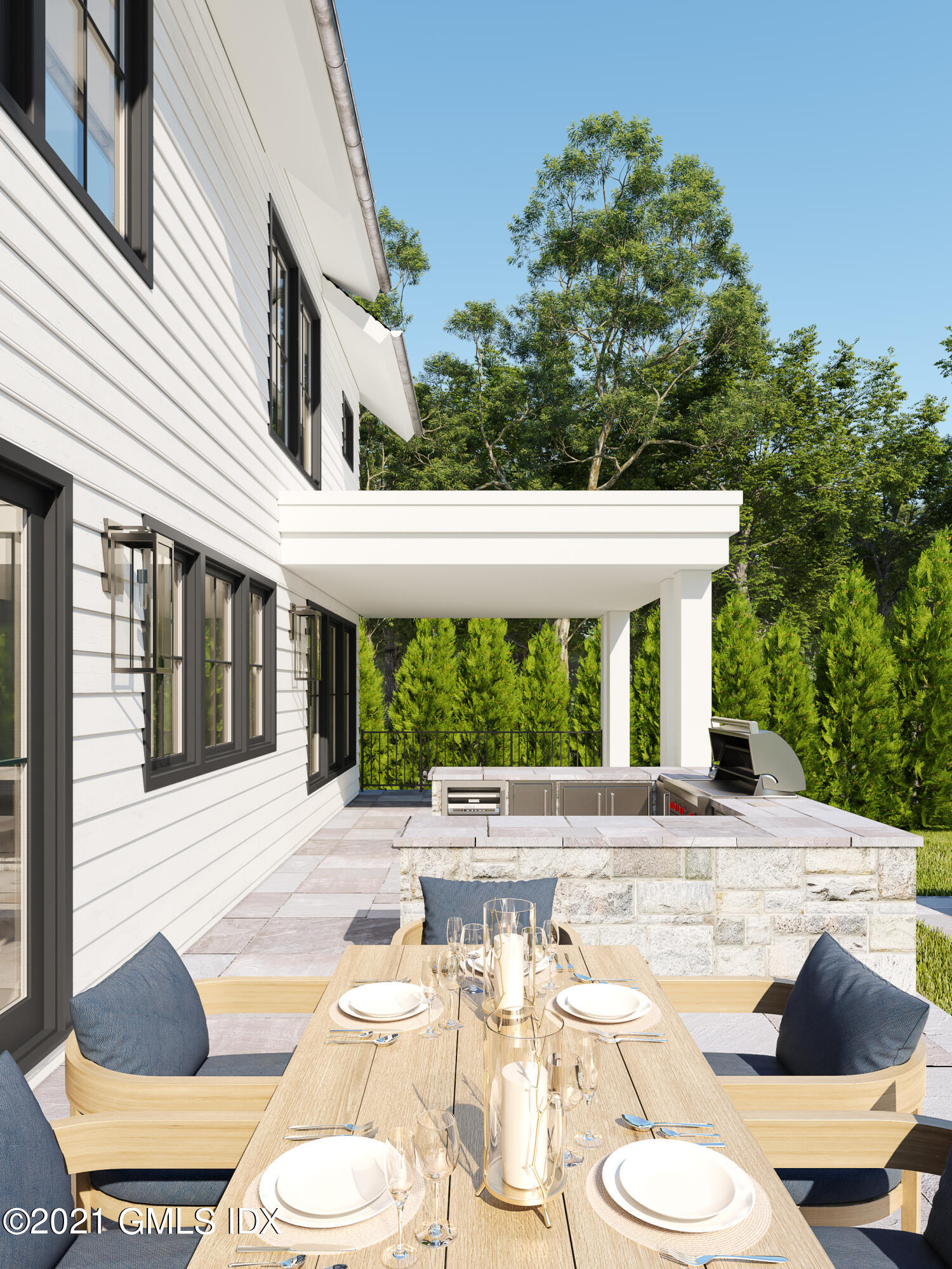 22 Birch Lane Greenwich, CT 06830 - Photo 4 of 8 a view of a patio with table and chairs potted plants and floor to ceiling window