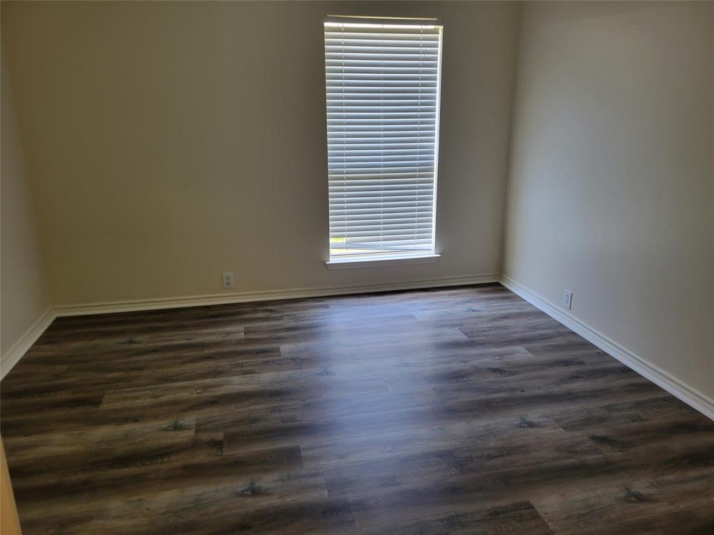 2913 Rush Creek Road McKinney, TX 75072 - Photo 16 of 32 3rd bedroom with large walk-in closet and new laminate flooring