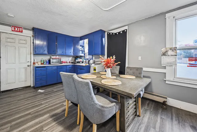 a kitchen with refrigerator and cabinets