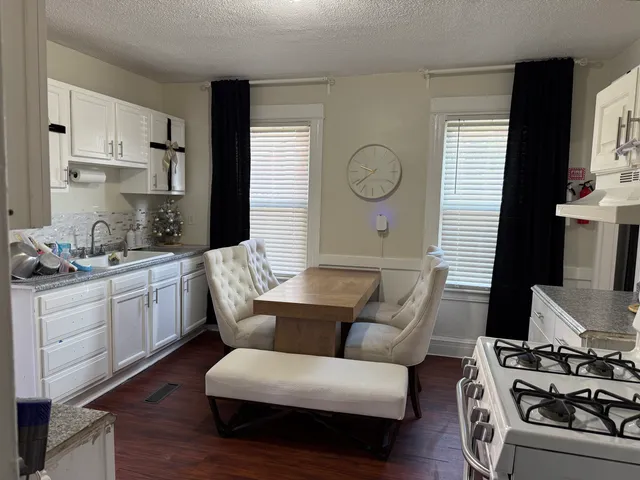 a bathroom with a toilet and a shower curtain