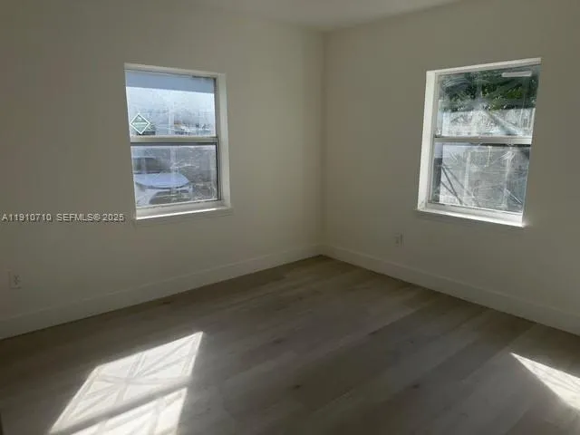 a view of small space with wooden floor