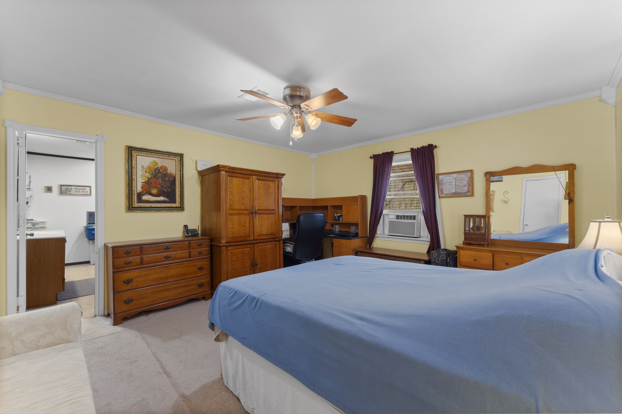 11281 Clint Parker Road Conroe, TX 77303 - Photo 18 of 32 a bedroom with a bed and dresser