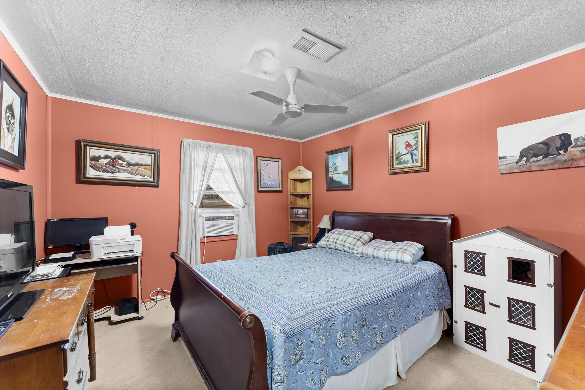 11281 Clint Parker Road Conroe, TX 77303 - Photo 22 of 32 a bedroom with a bed and a desk