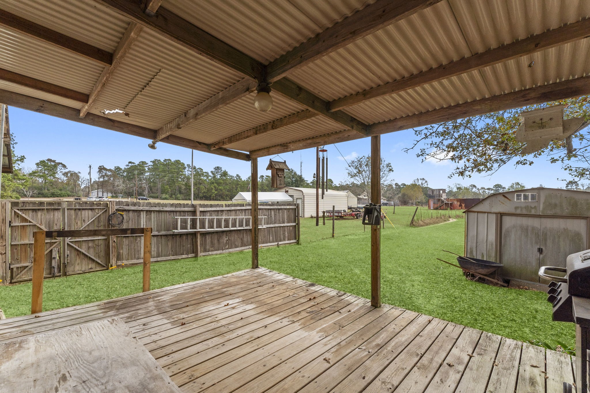 11281 Clint Parker Road Conroe, TX 77303 - Photo 24 of 32 a view of a backyard with wooden floor