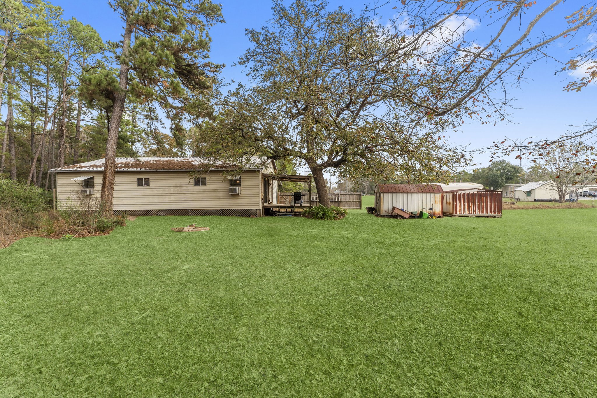 11281 Clint Parker Road Conroe, TX 77303 - Photo 26 of 32 a view of a house with backyard and garden