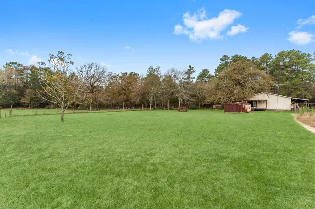 a view of a house with a big yard