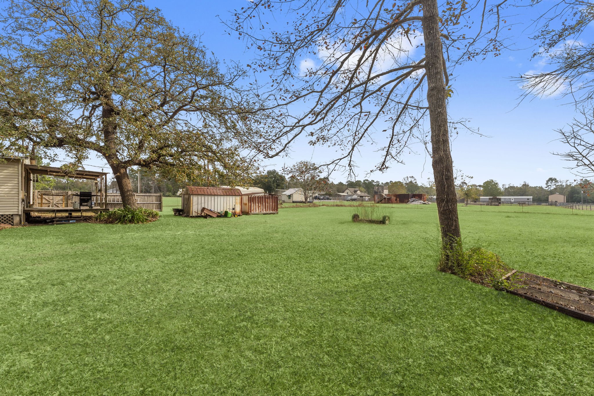 11281 Clint Parker Road Conroe, TX 77303 - Photo 29 of 32 a view of a house with a big yard