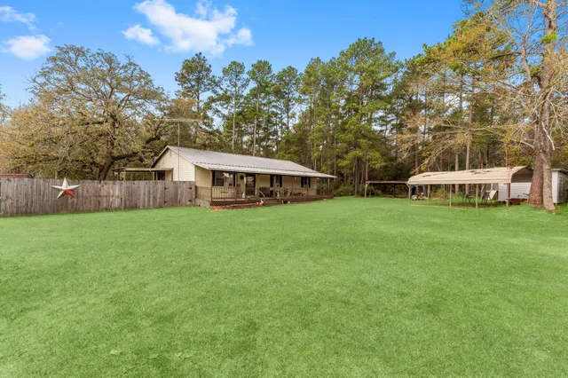a view of a house with a big yard