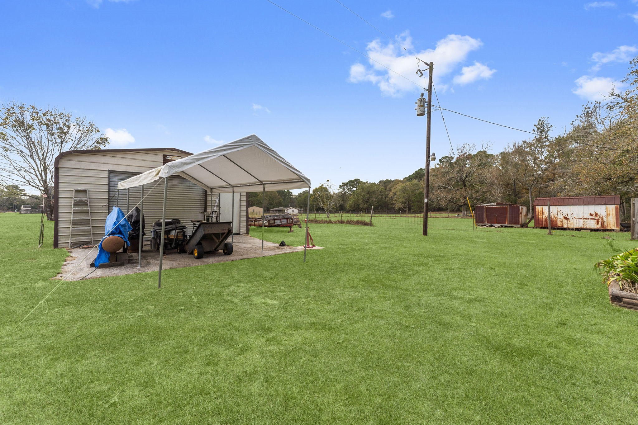 11281 Clint Parker Road Conroe, TX 77303 - Photo 31 of 32 a view of a house with a big yard