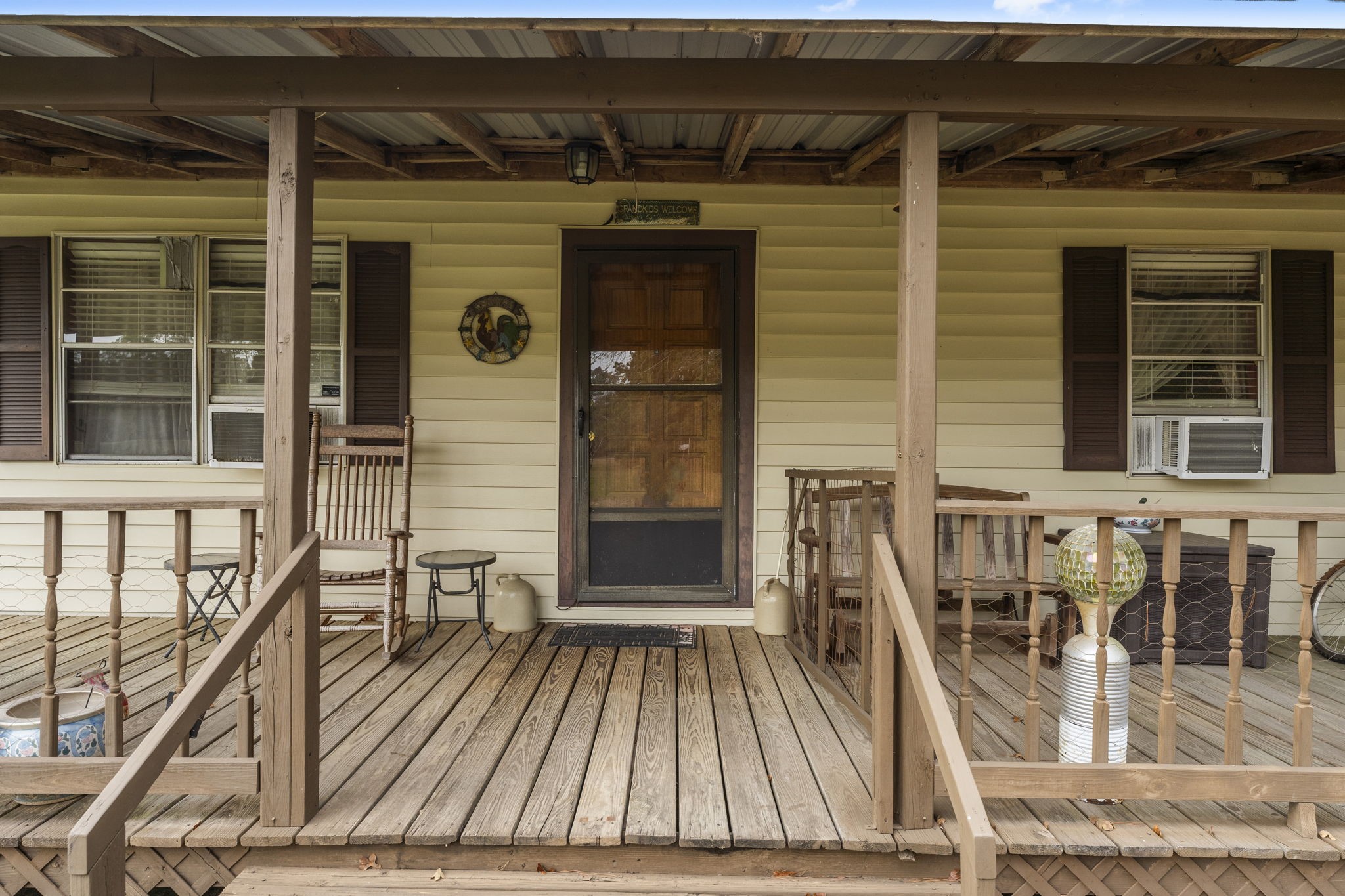 11281 Clint Parker Road Conroe, TX 77303 - Photo 4 of 32 a view of a balcony with two couches