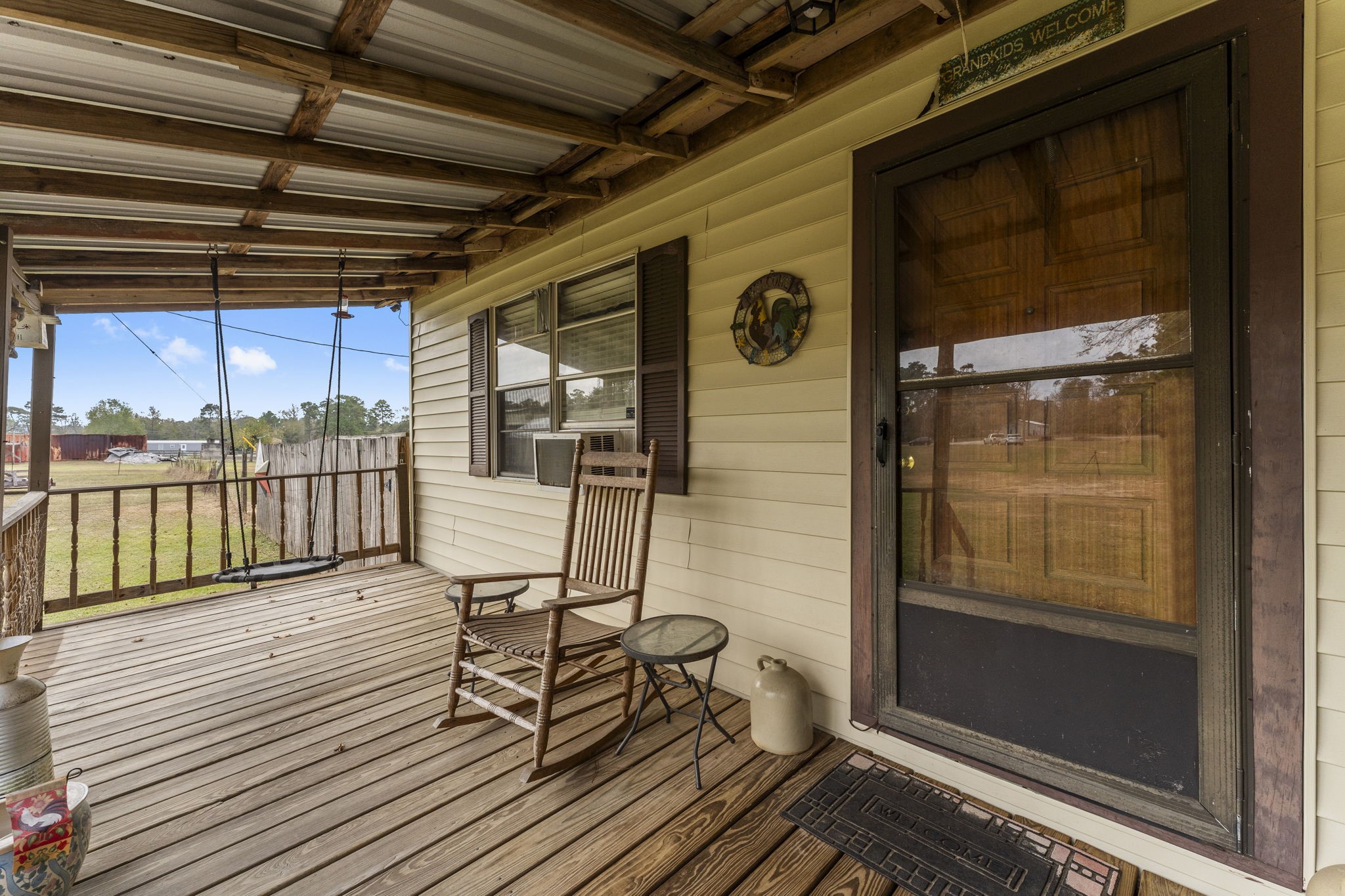 11281 Clint Parker Road Conroe, TX 77303 - Photo 5 of 32 a view of a balcony with chairs