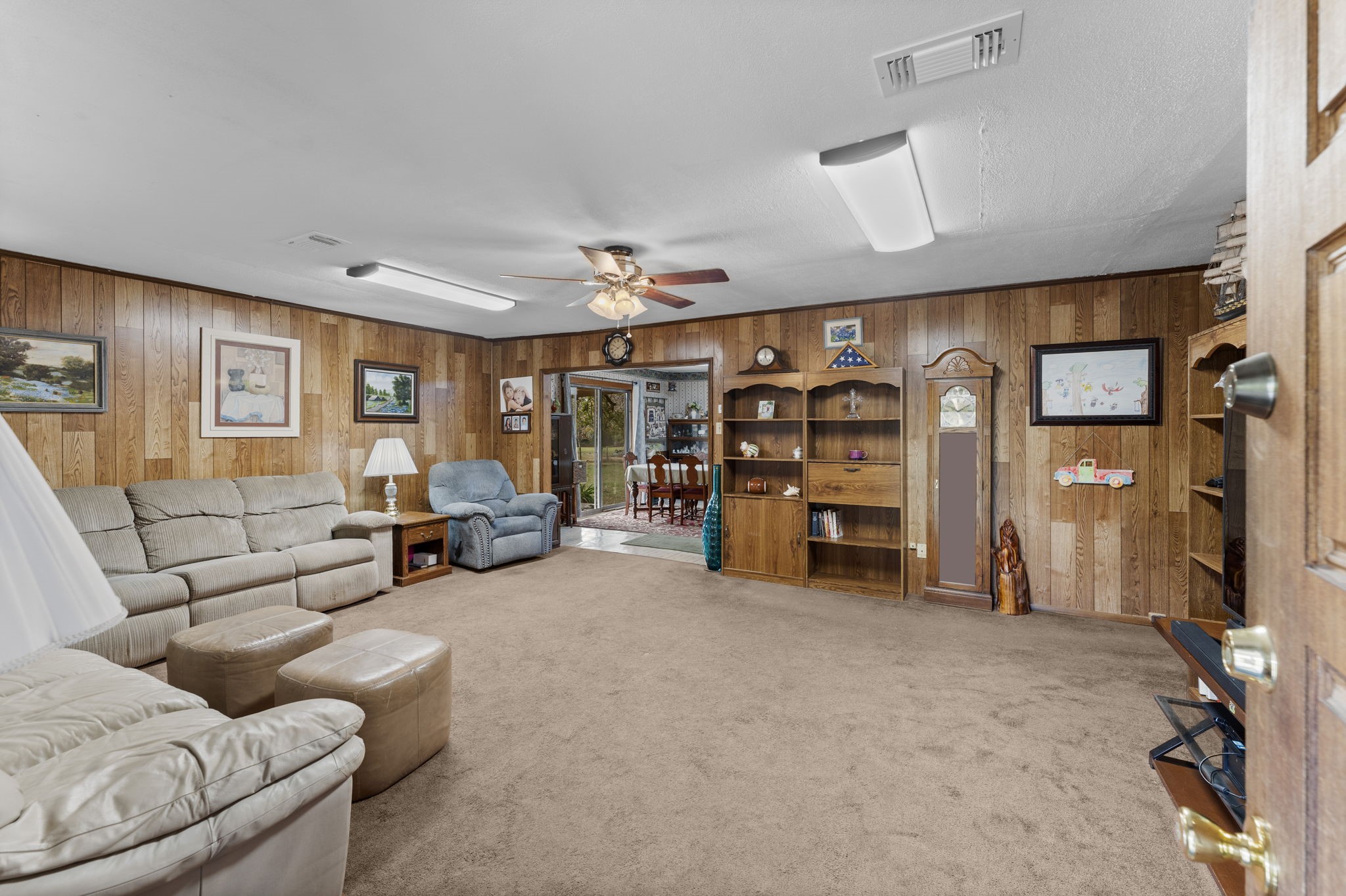 11281 Clint Parker Road Conroe, TX 77303 - Photo 7 of 32 a living room with furniture and a large window
