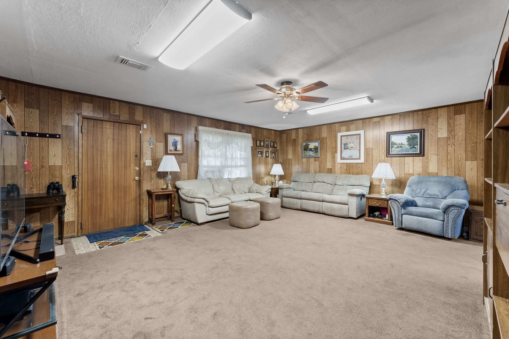11281 Clint Parker Road Conroe, TX 77303 - Photo 8 of 32 a living room with furniture and a chandelier