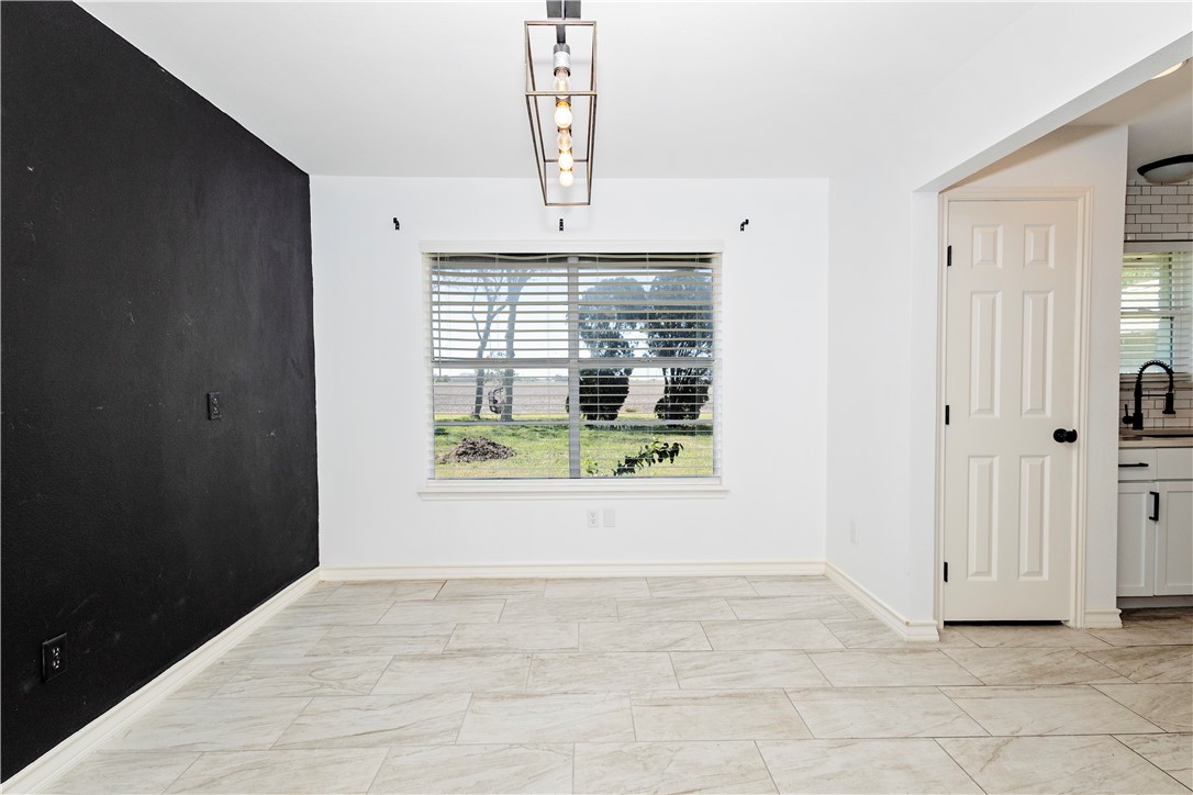 7629 Lang Road Portland, TX 78374 - Photo 12 of 36 a view of an empty room with a window