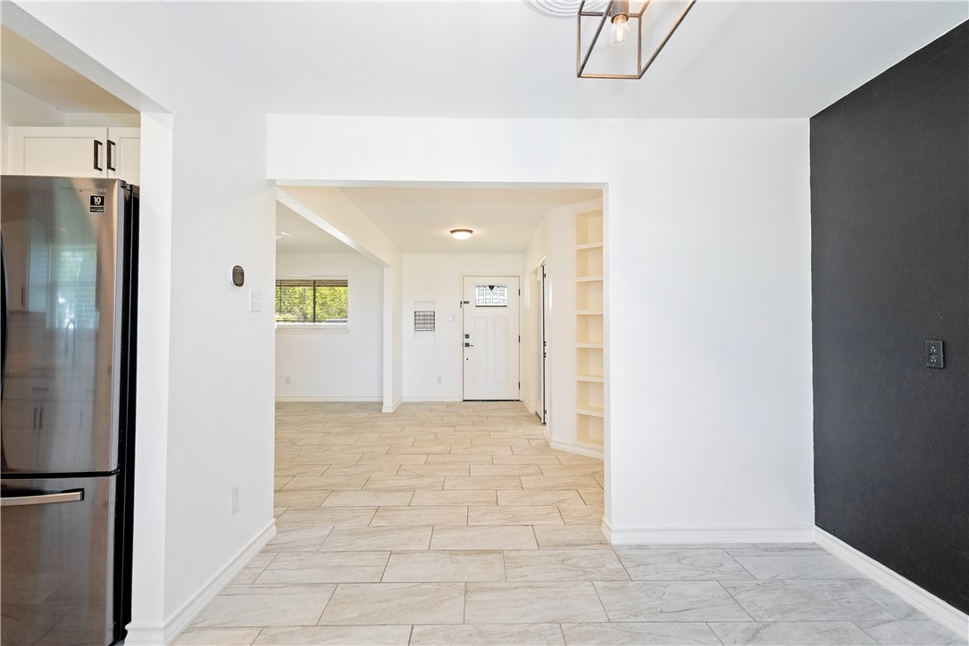 7629 Lang Road Portland, TX 78374 - Photo 13 of 36 a view of a hallway with wooden cabinets