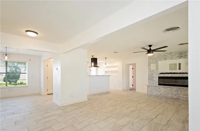 a view of a kitchen with a sink and a refrigerator