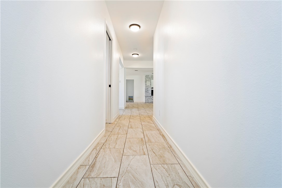 7629 Lang Road Portland, TX 78374 - Photo 28 of 36 a view of a hallway with wooden floor