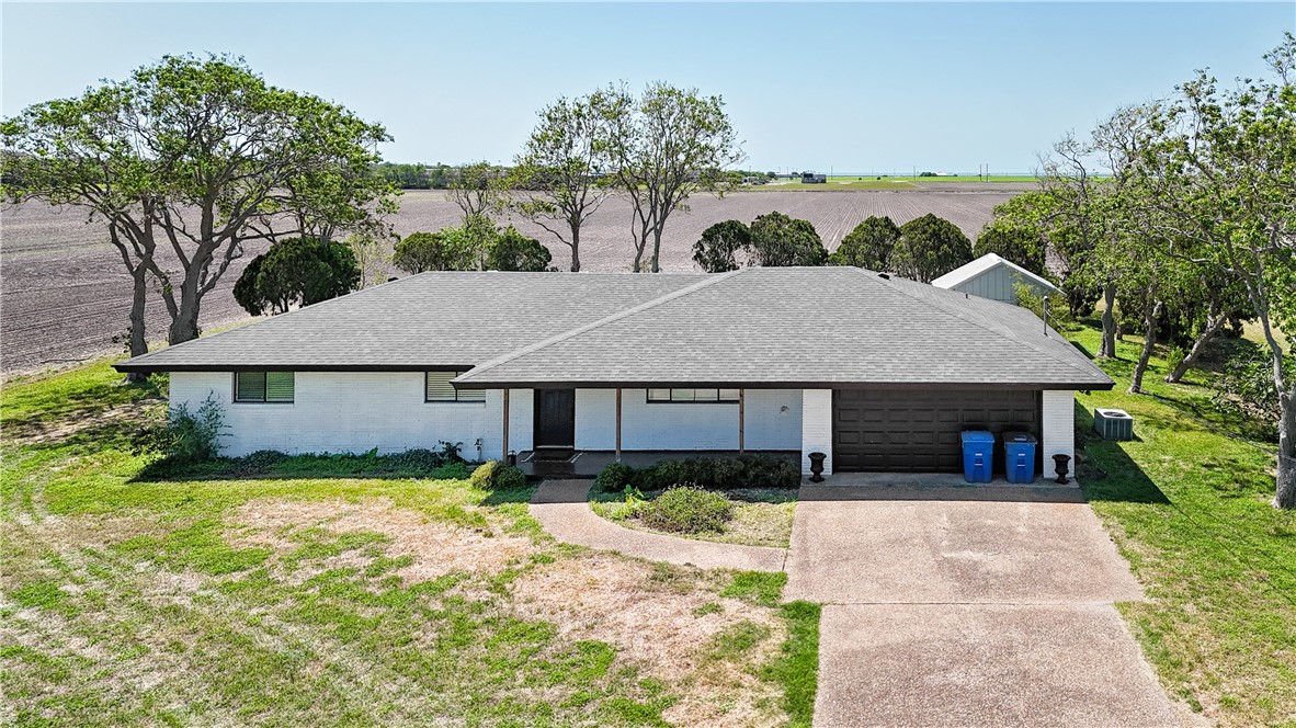 7629 Lang Road Portland, TX 78374 - Photo 3 of 36 front view of a house with a yard