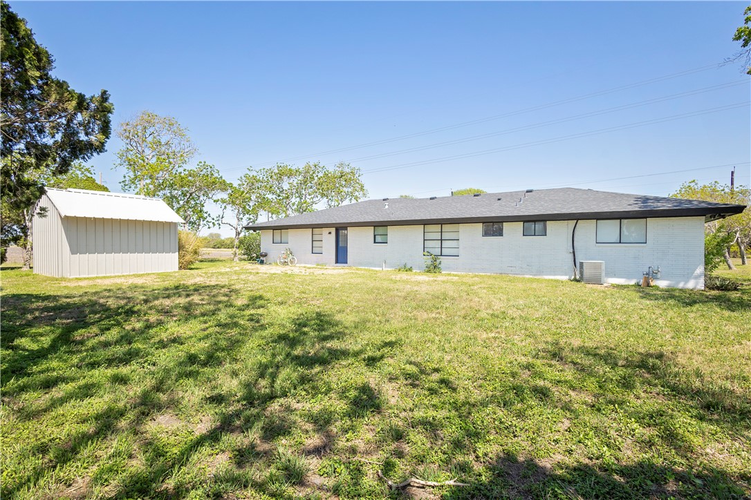 7629 Lang Road Portland, TX 78374 - Photo 32 of 36 a front view of a house with a garden