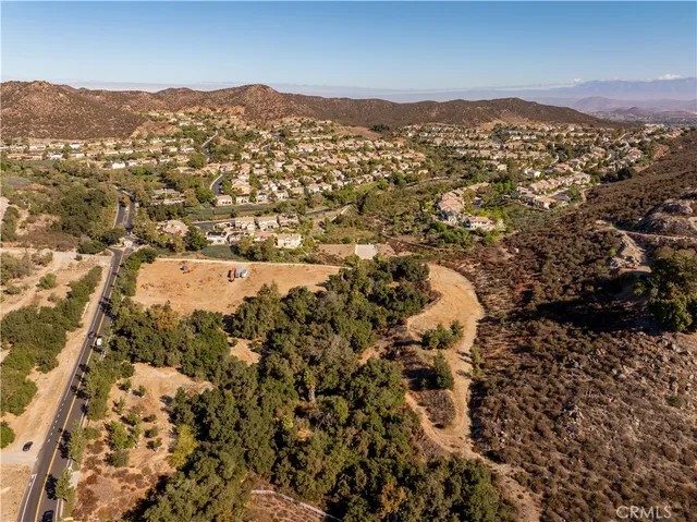 an aerial view of residential house and car parked
