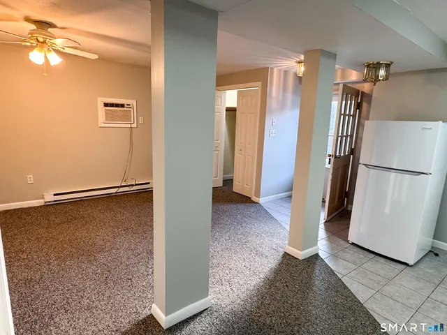 a view of a street with a building in the background