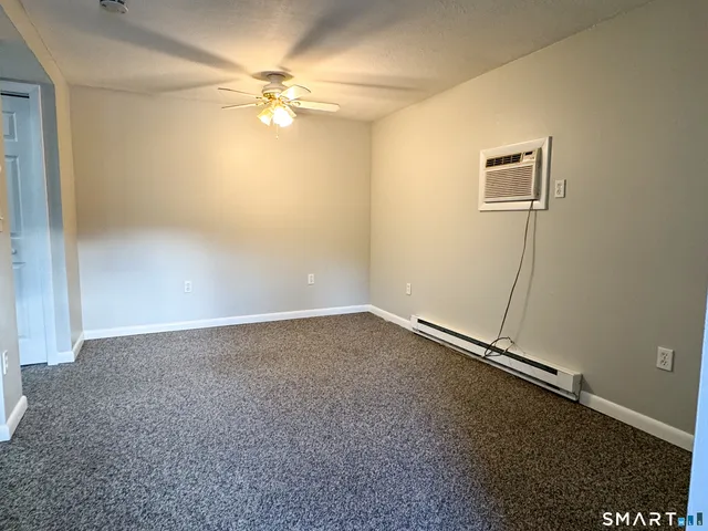 a view of a kitchen cabinets and empty room